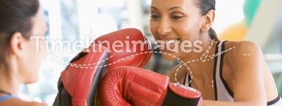 Women Boxing Together At Gym