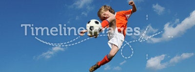 Boy playing soccer or football