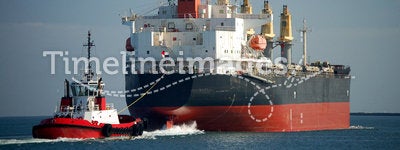 Cargo Ship With Tug