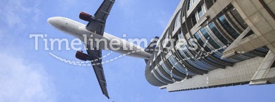 Airplane on the top of modern building.