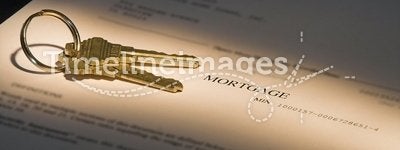 Highlighted mortgage document and house keys