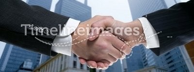 Businessman partners shaking hands with suit