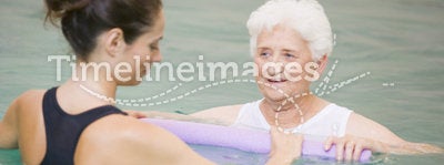 Therapist And Senior Patient In Hydro Pool